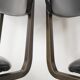 Pair of industrial style chairs in metal and faux black leather