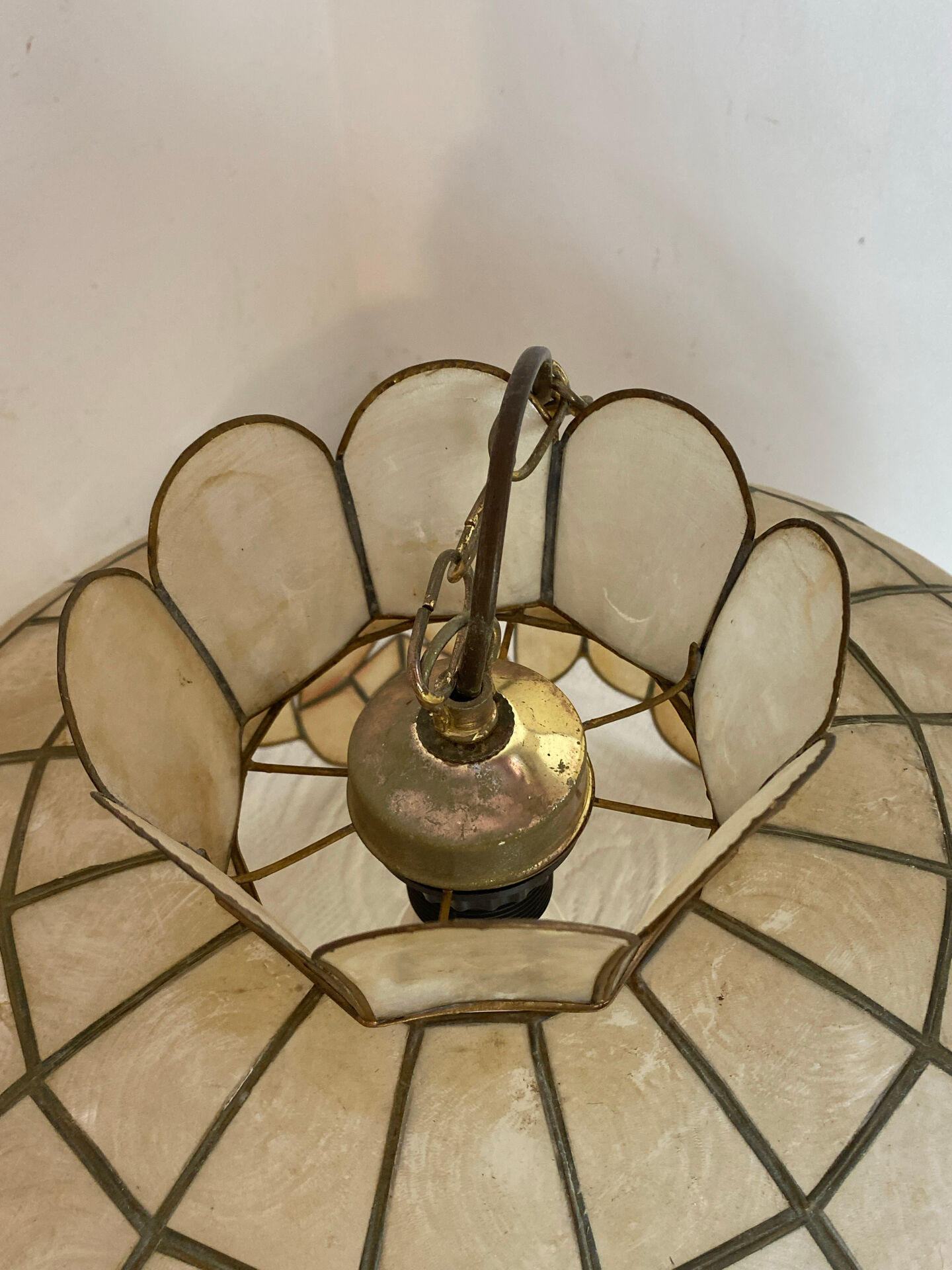 Large mother-of-pearl and brass chandelier with floral decoration.