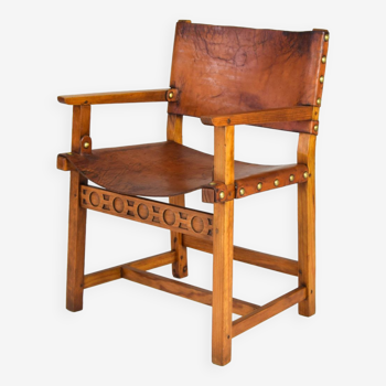 Fauteuil espagnol castellana brutaliste du 19ème siècle en chêne et cuir cognac