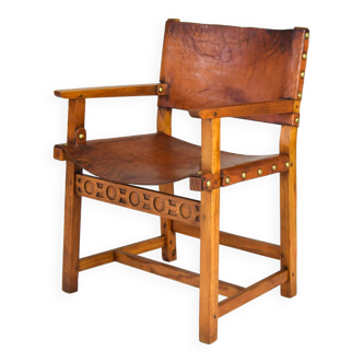 Fauteuil espagnol castellana brutaliste du 19ème siècle en chêne et cuir cognac