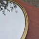 Round mirror of the 50s in gold metal 33cm in diameter