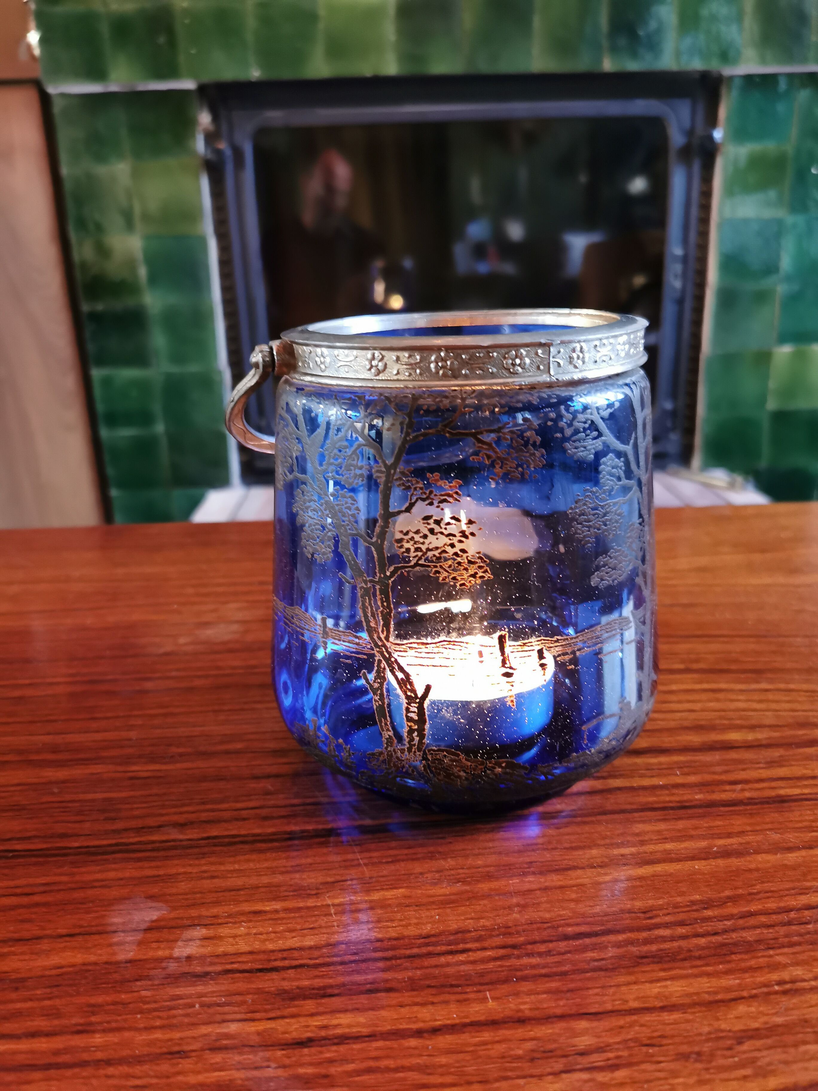 Old ice or biscuit bucket made of golden decor blue glass