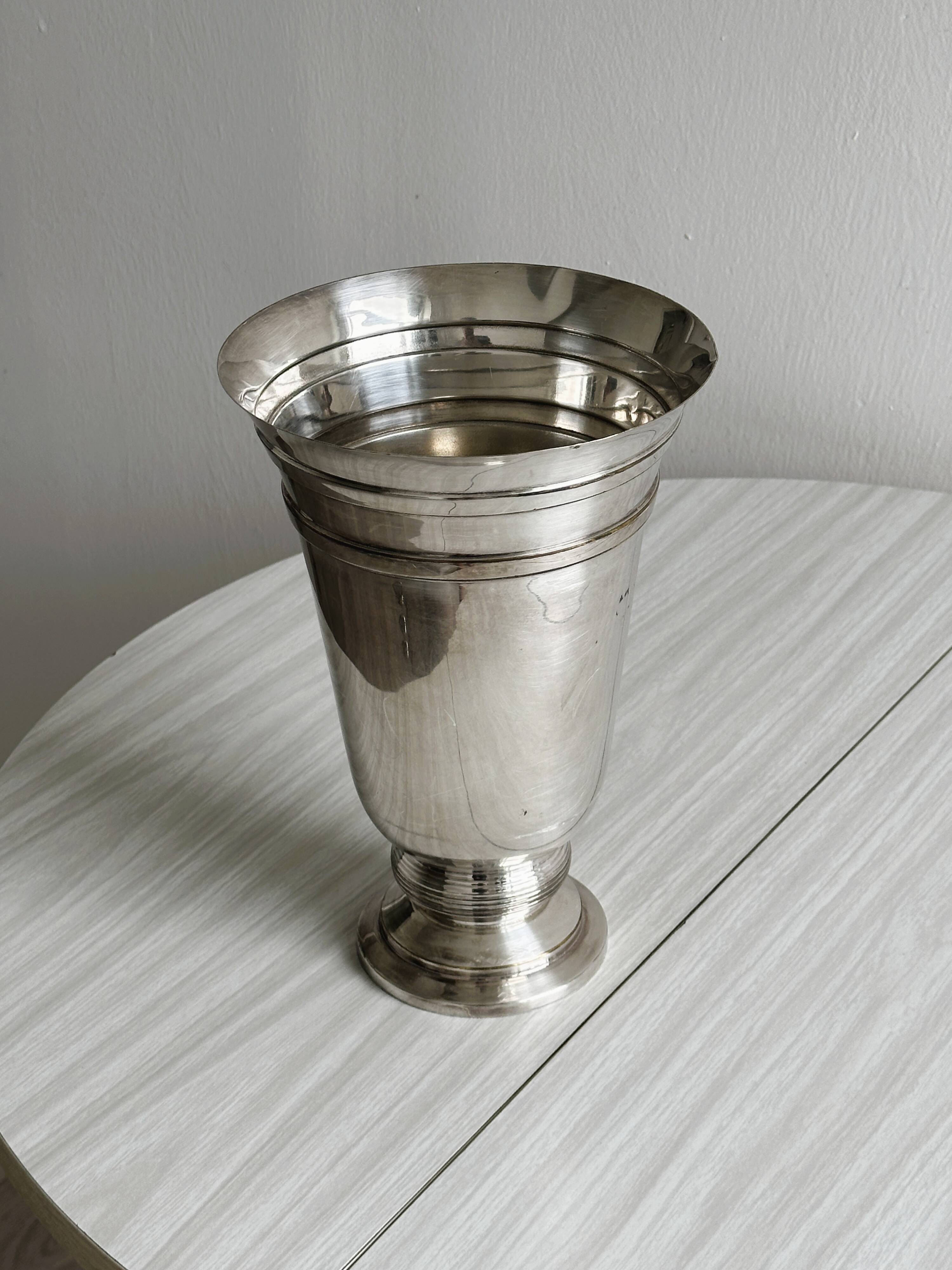 Antique shiny metal vase