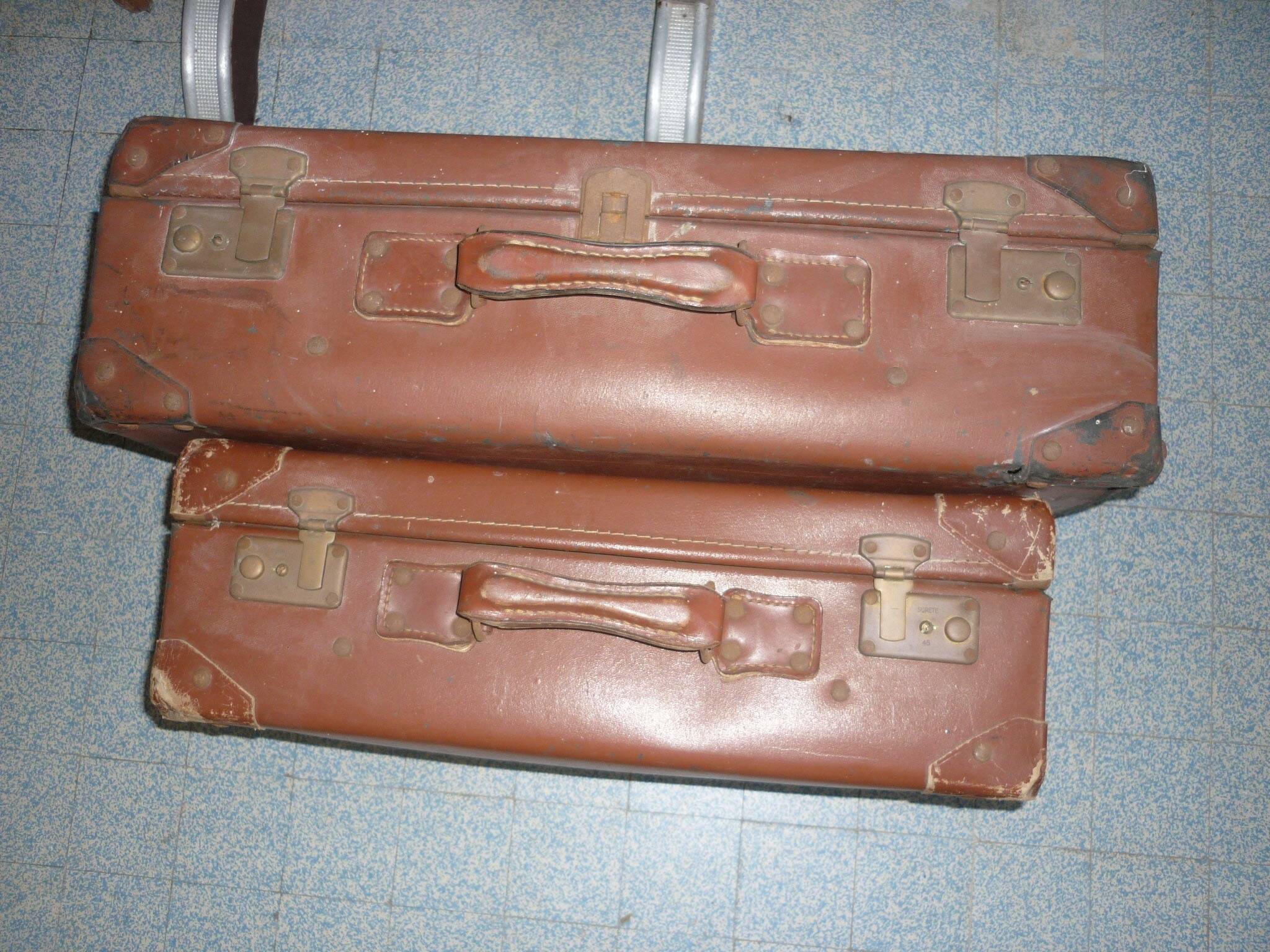 Pair of red suitcases from the 1950s