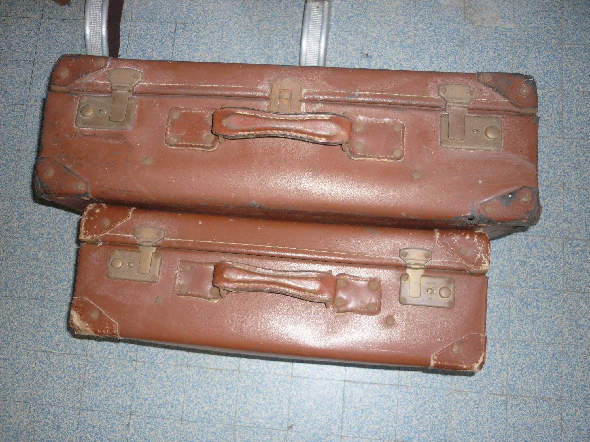 Pair of red suitcases from the 1950s