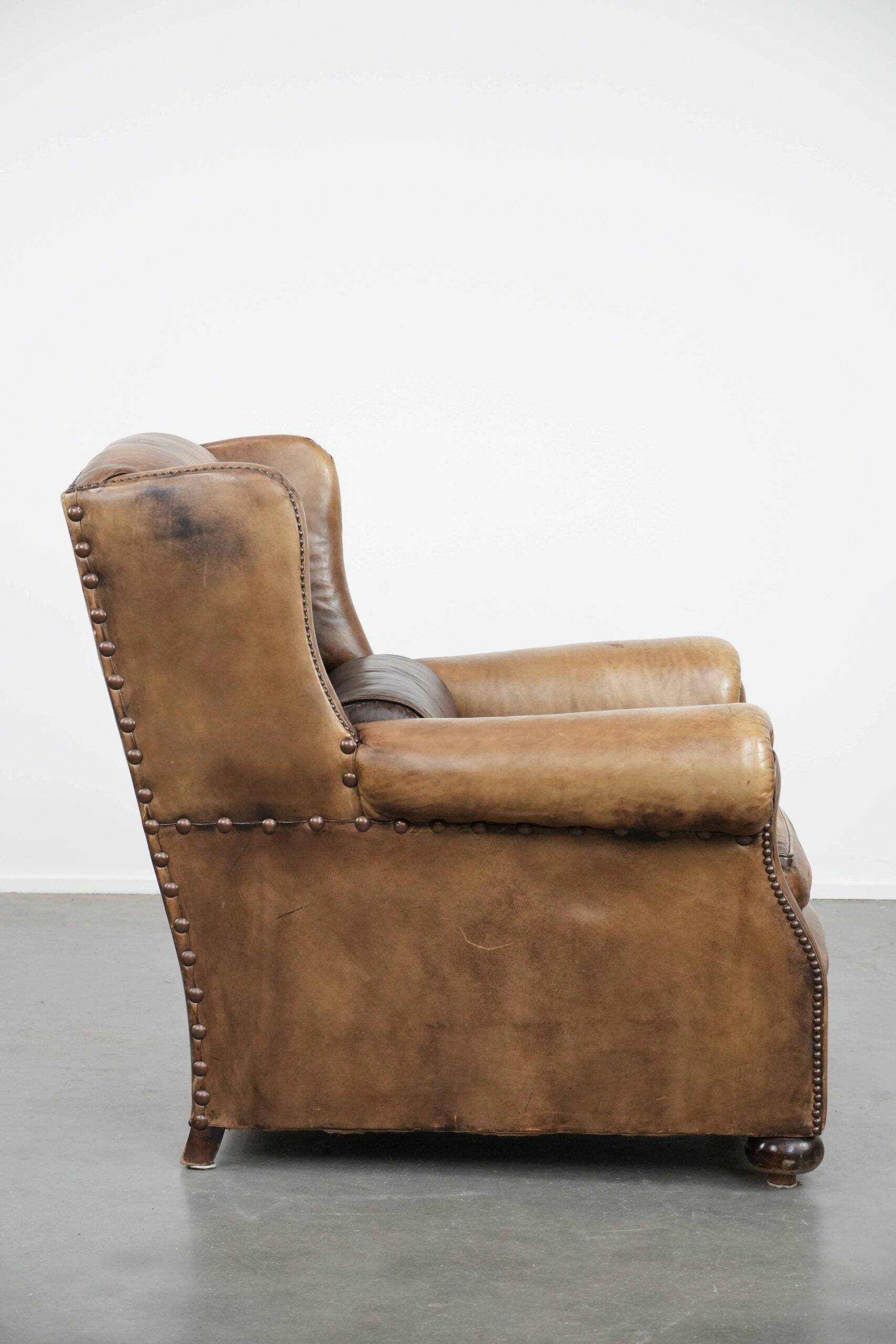 Luxury and large cowhide leather wingback chair in English style