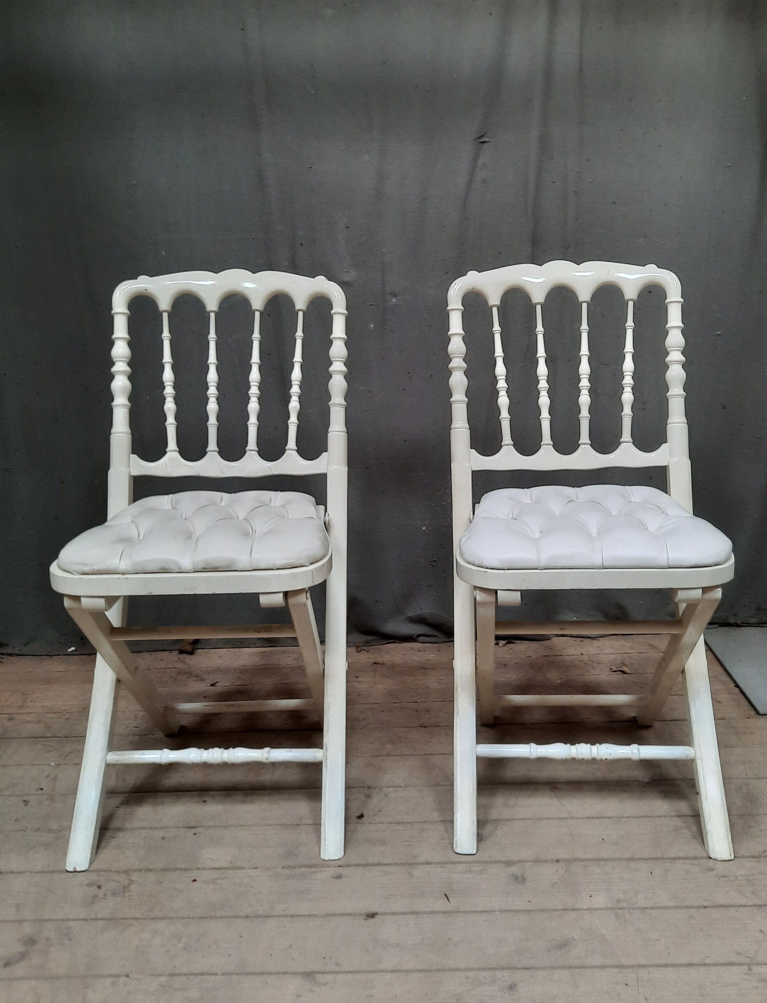 Pair of upholstered folding chairs
