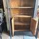 Black painted wardrobe with two glass doors and an interior sideboard.