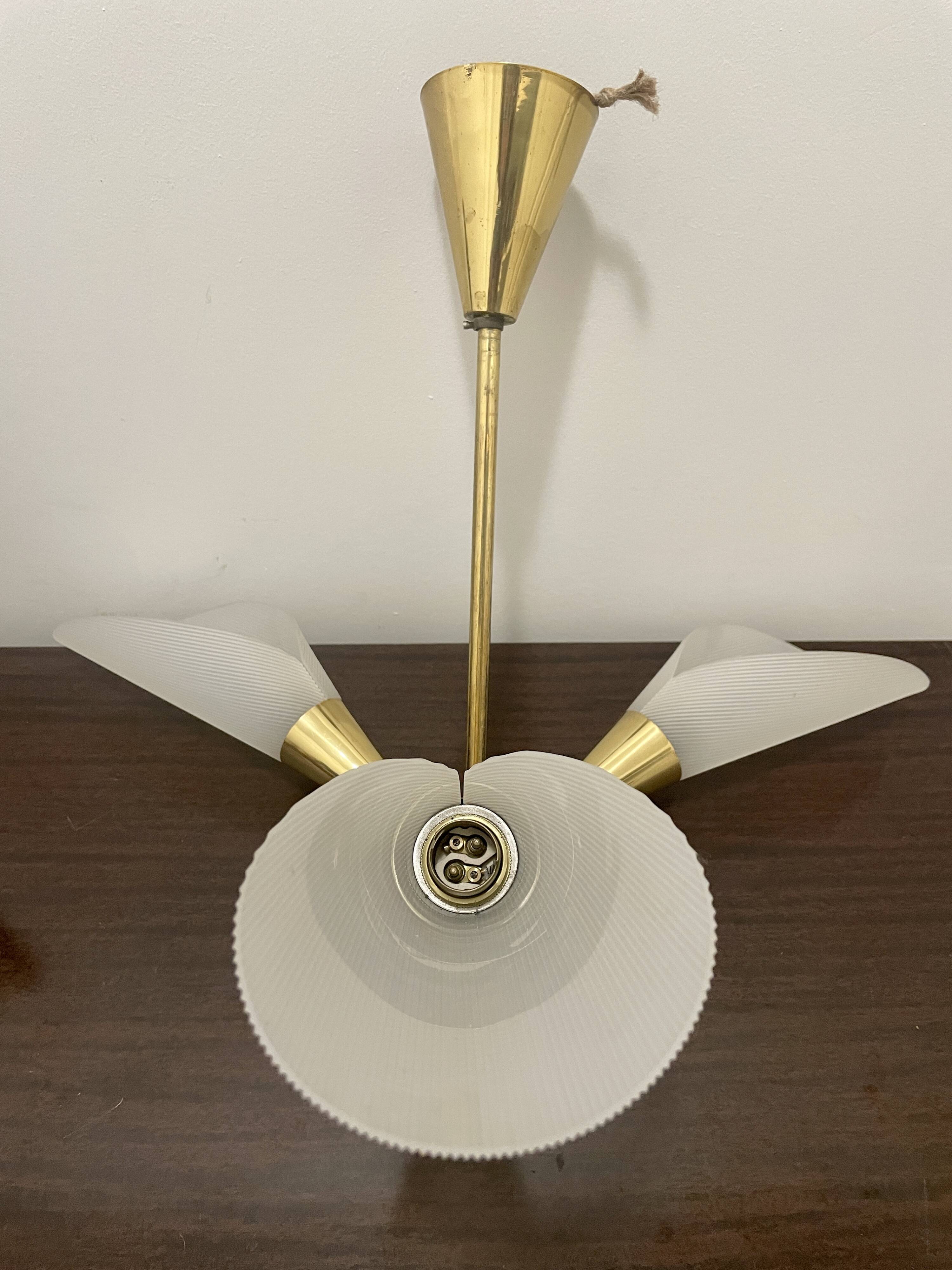 Vintage chandelier with plexiglass and brass cones