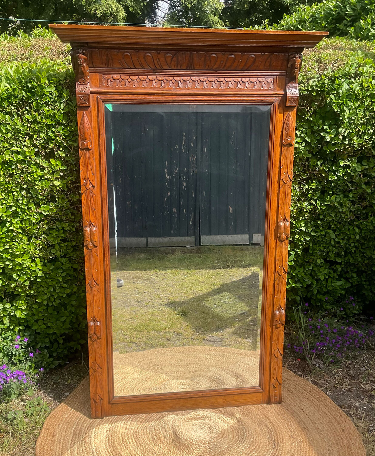 Antique large trumeau mirror in solid wood and bevelled glass.