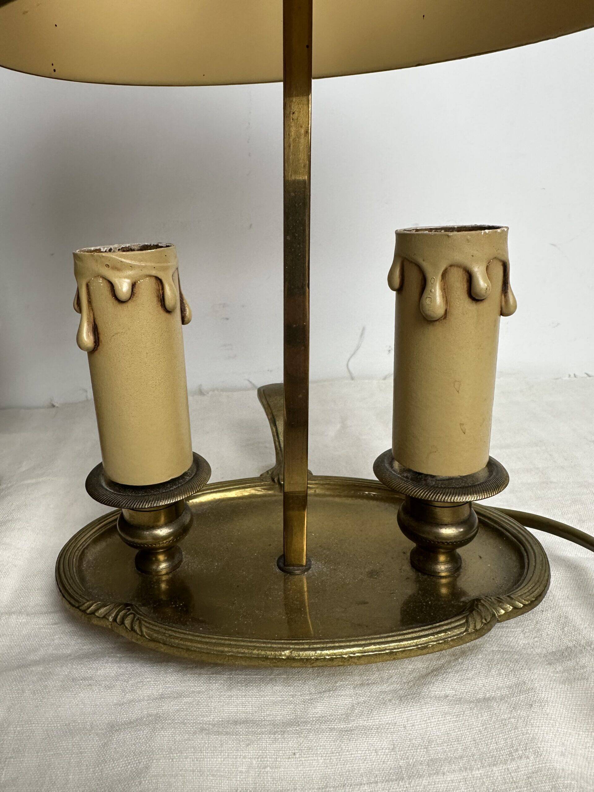 A pair of old brass bed warmers.