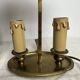 A pair of old brass bed warmers.