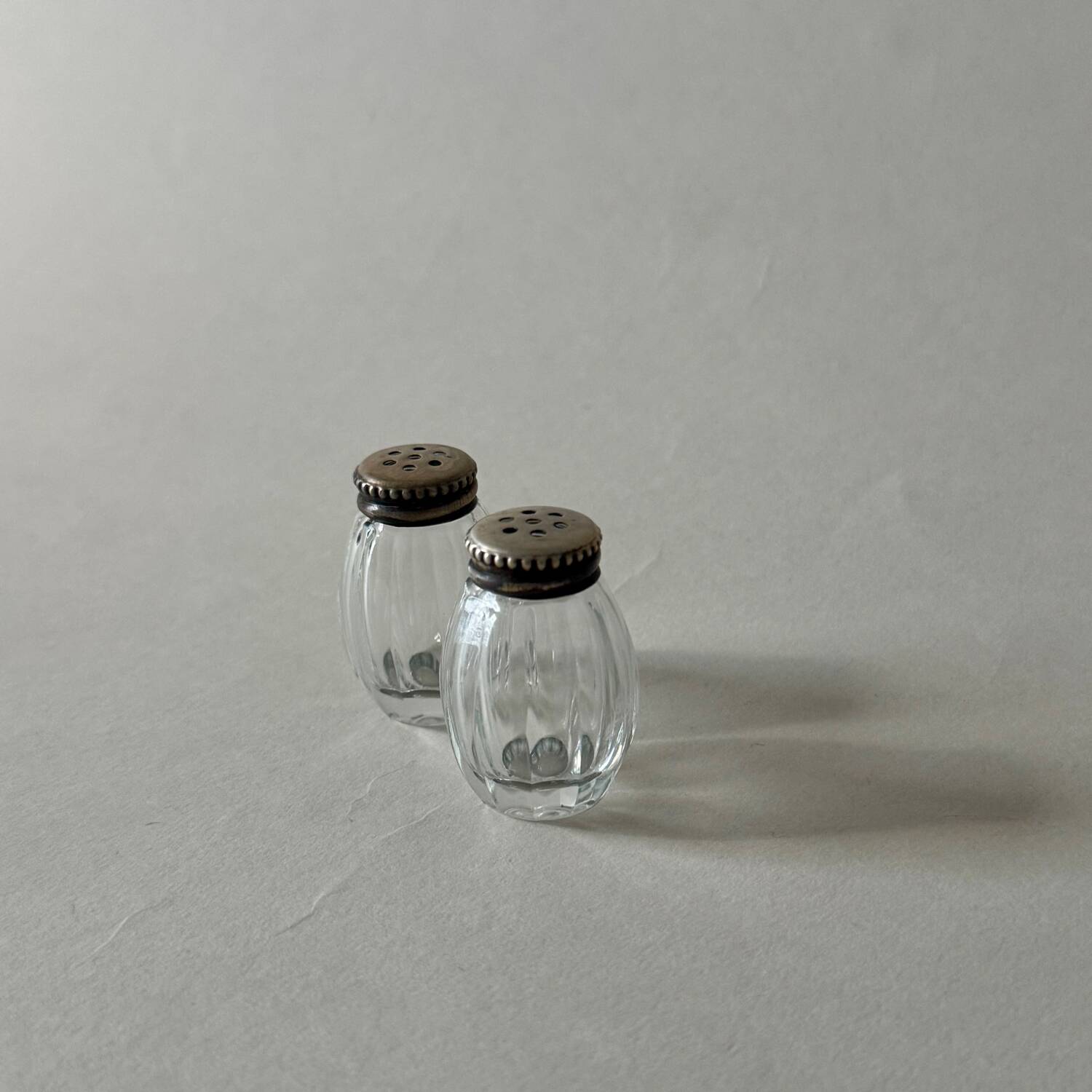 Pair of vintage Christofle glass and silver pearl salt cellars