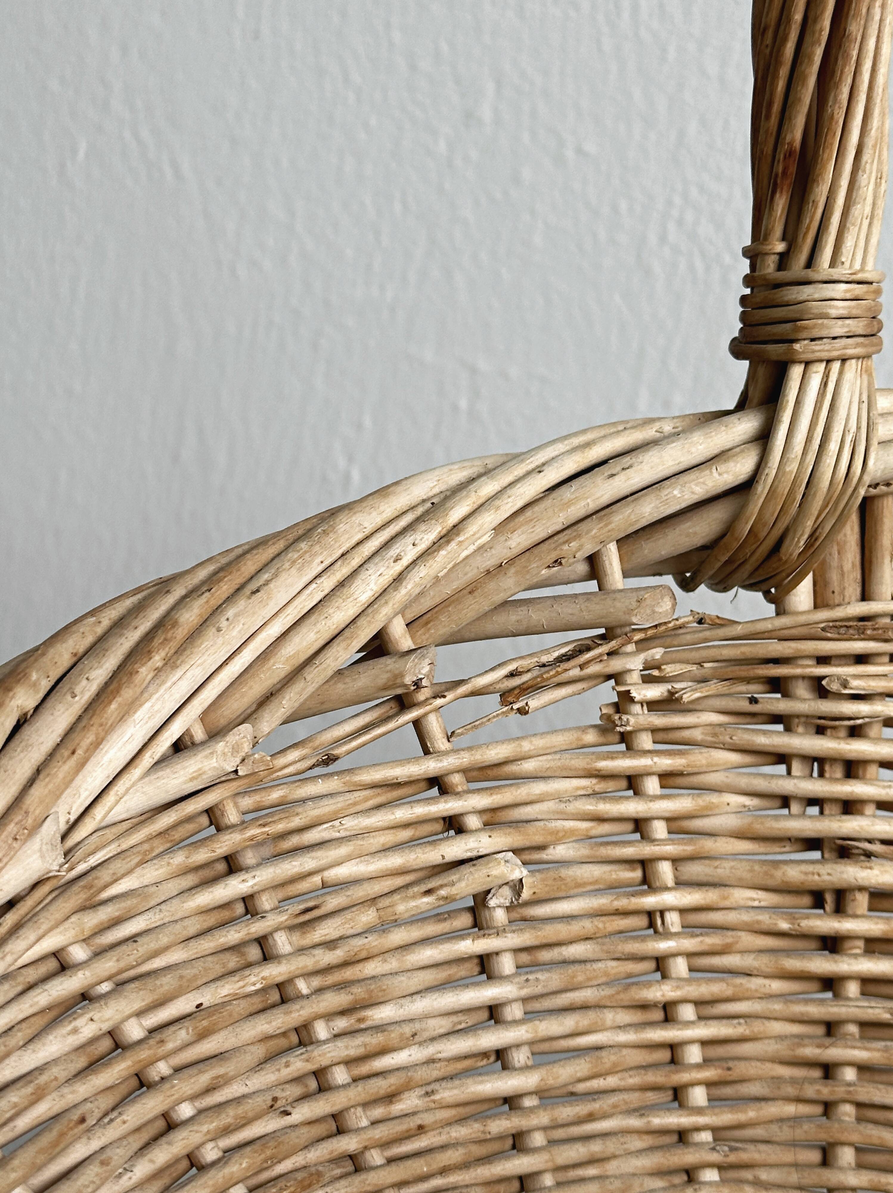 Large antique woven wicker basket with handle.