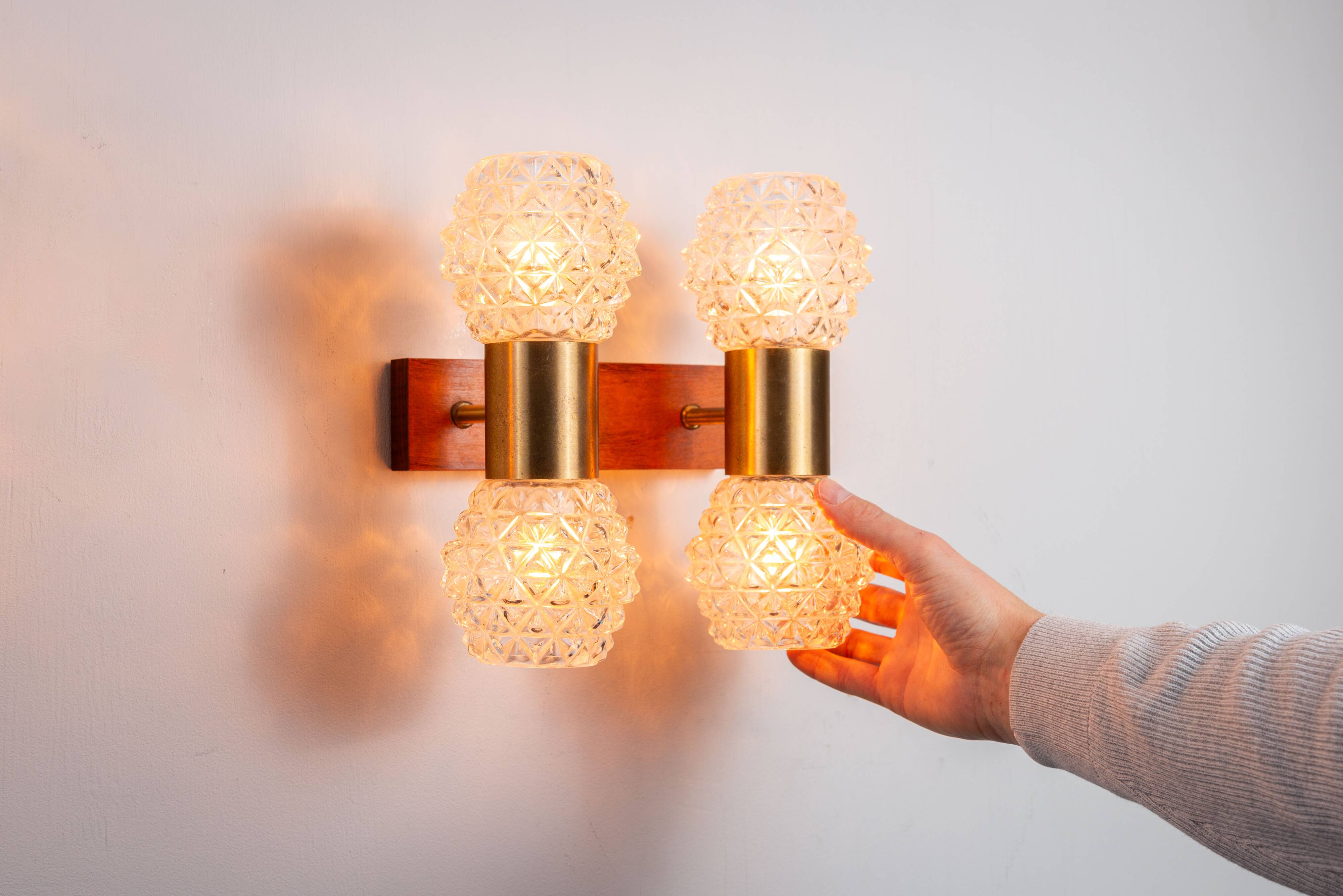 Pair of Swedish wall lamps with teak wood, brass and glass cup shade