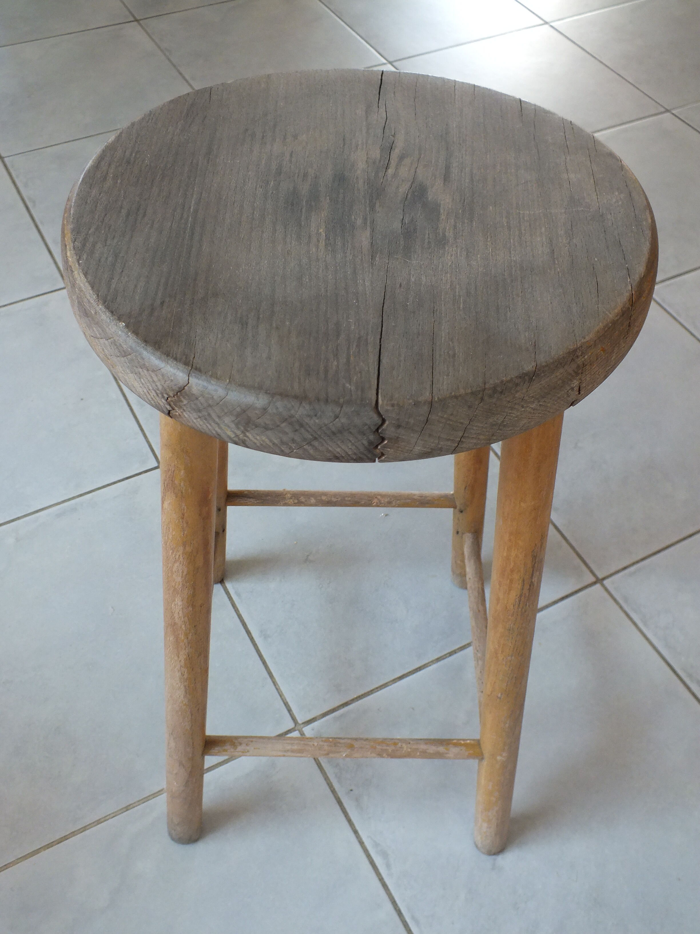 Vintage stool in patinated natural wood