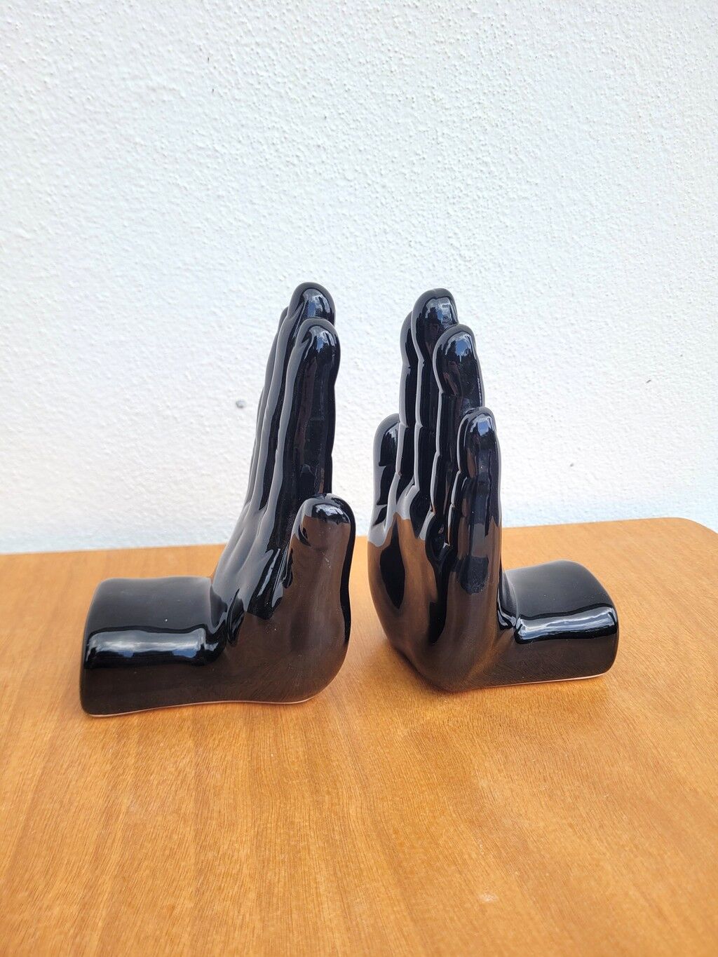 Pair of vintage black ceramic hand bookends