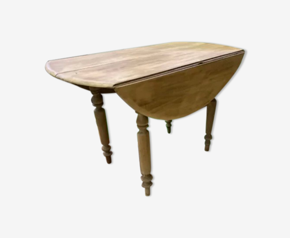 Table ronde à rabats en bois brut