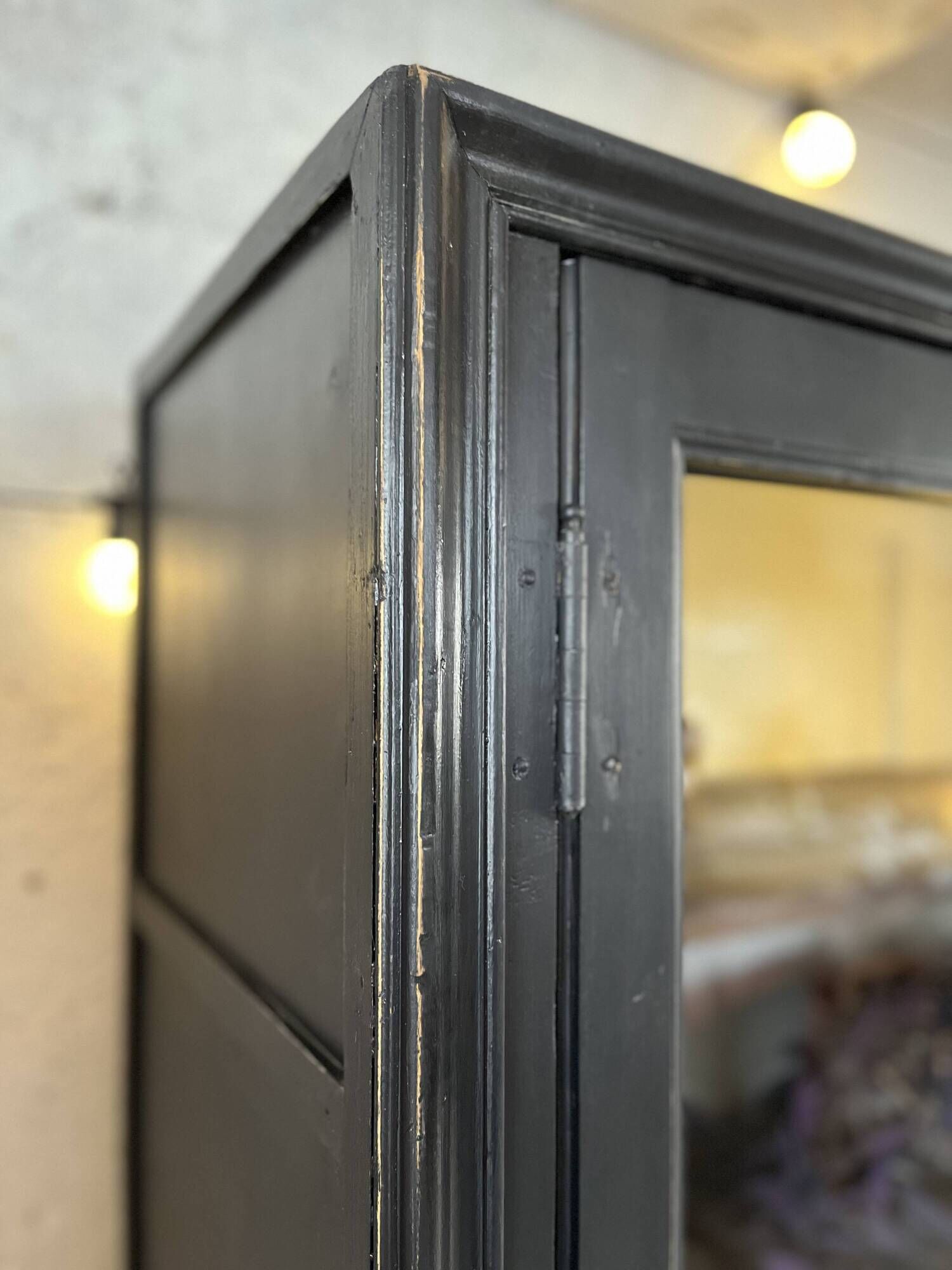 Aged patinated black display cabinet