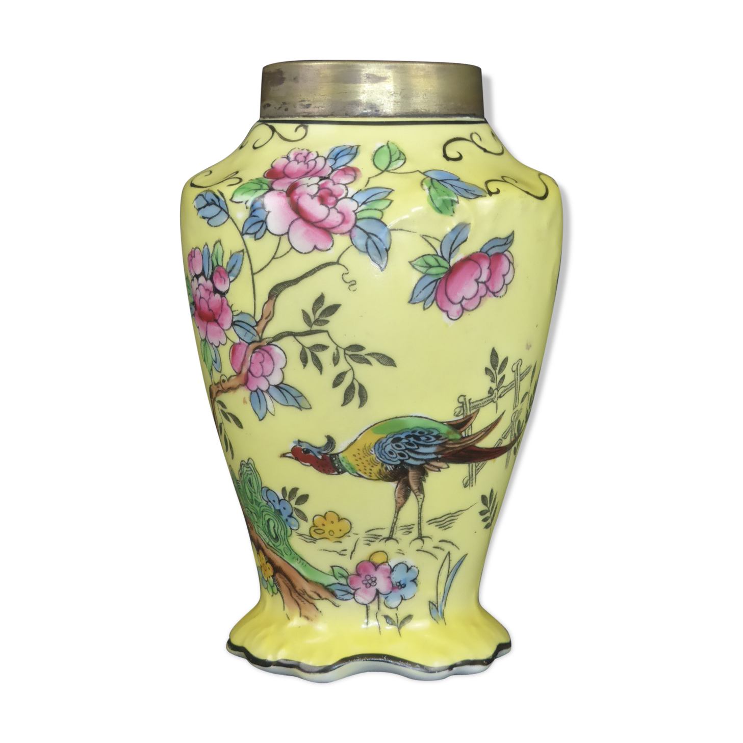 Old yellow ceramic vase decorated with flowers and a pheasant