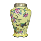 Old yellow ceramic vase decorated with flowers and a pheasant