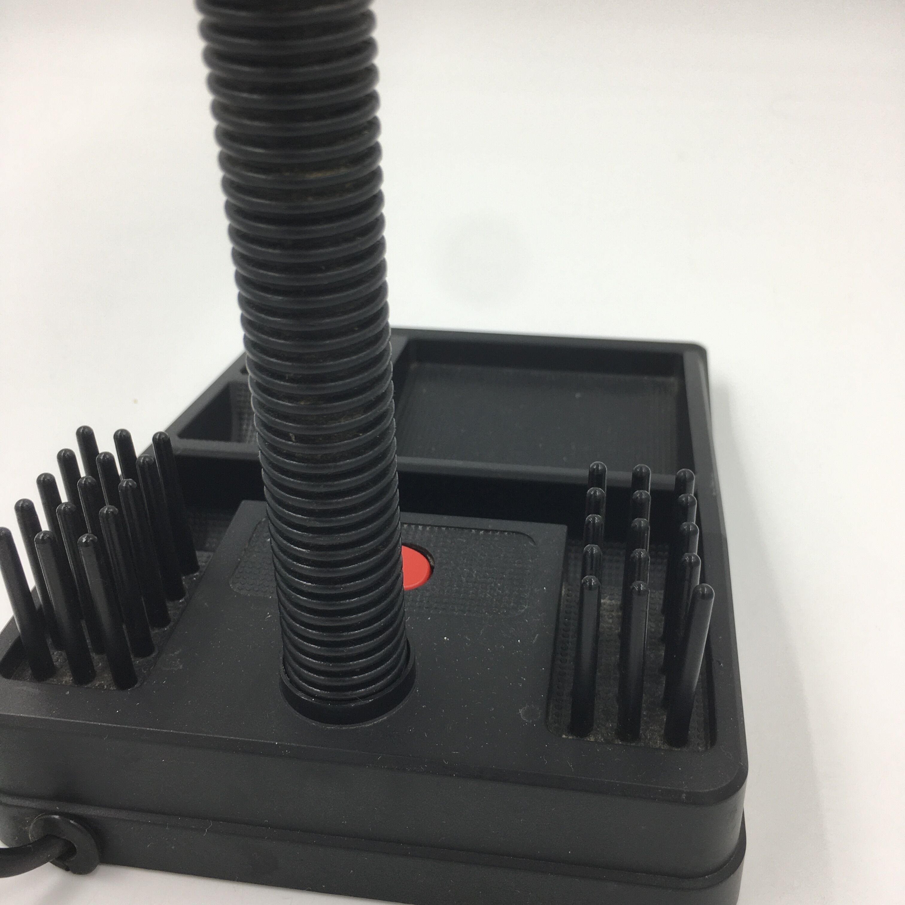 Duo of red and black flexible desk lamps with pencil holder