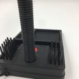 Duo of red and black flexible desk lamps with pencil holder