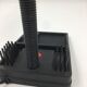 Duo of red and black flexible desk lamps with pencil holder
