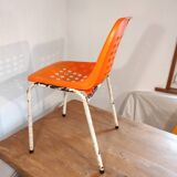 Chair with openwork plastic shell 1970