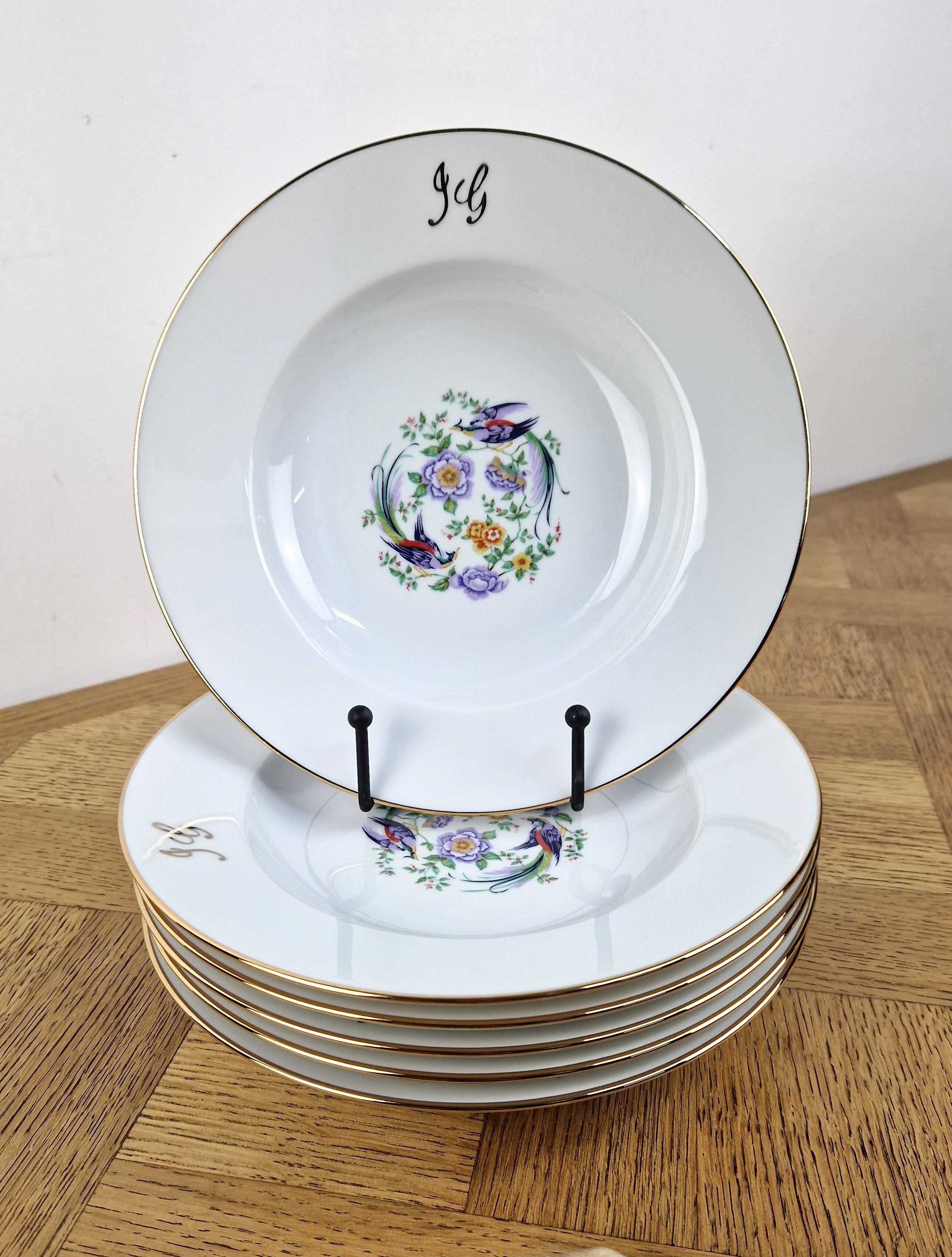 6 deep plates made of Limoges porcelain with a paradise bird design.