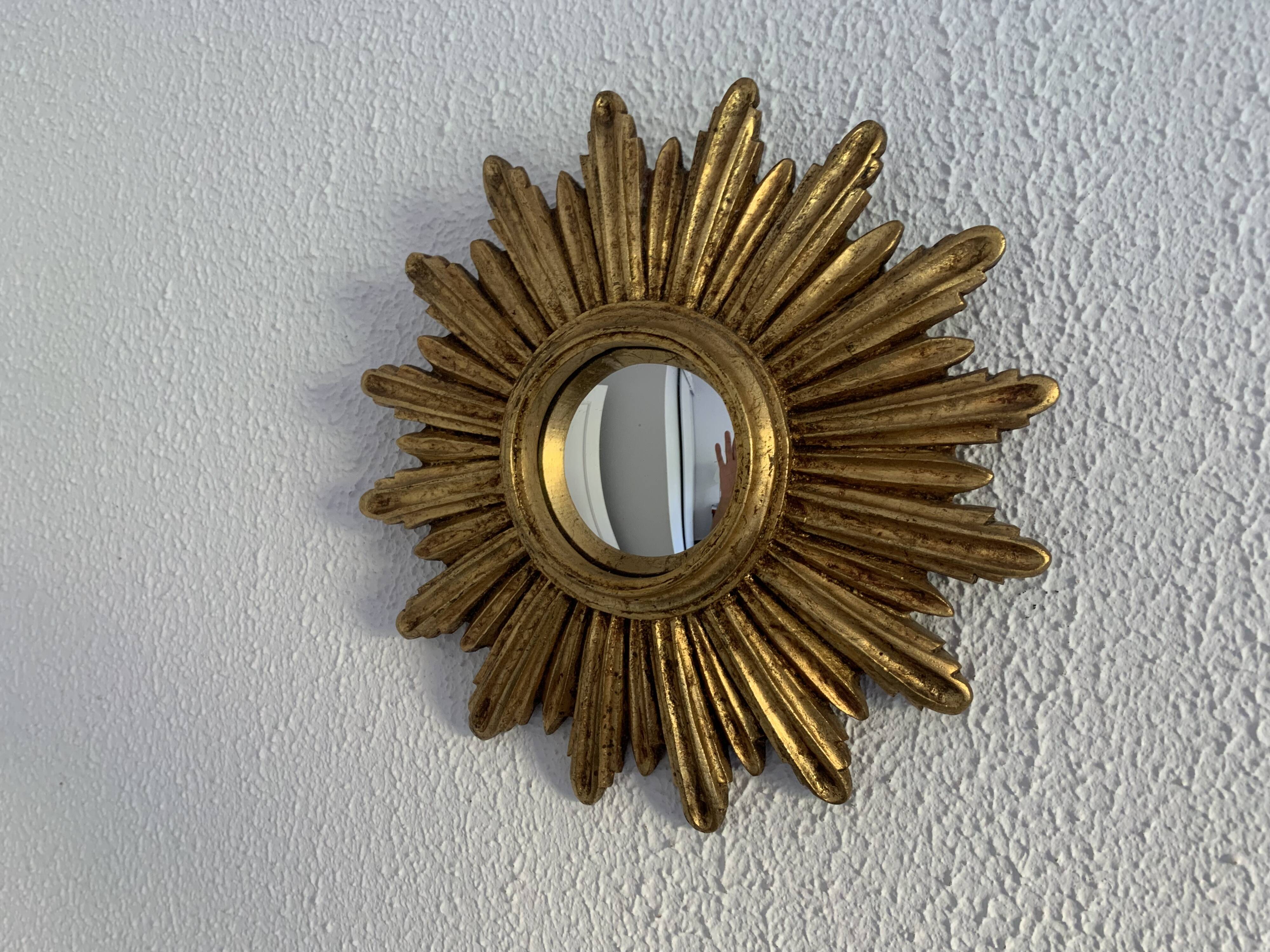 Vintage 1960s sunburst witch's eye mirror in gold - 27 cm