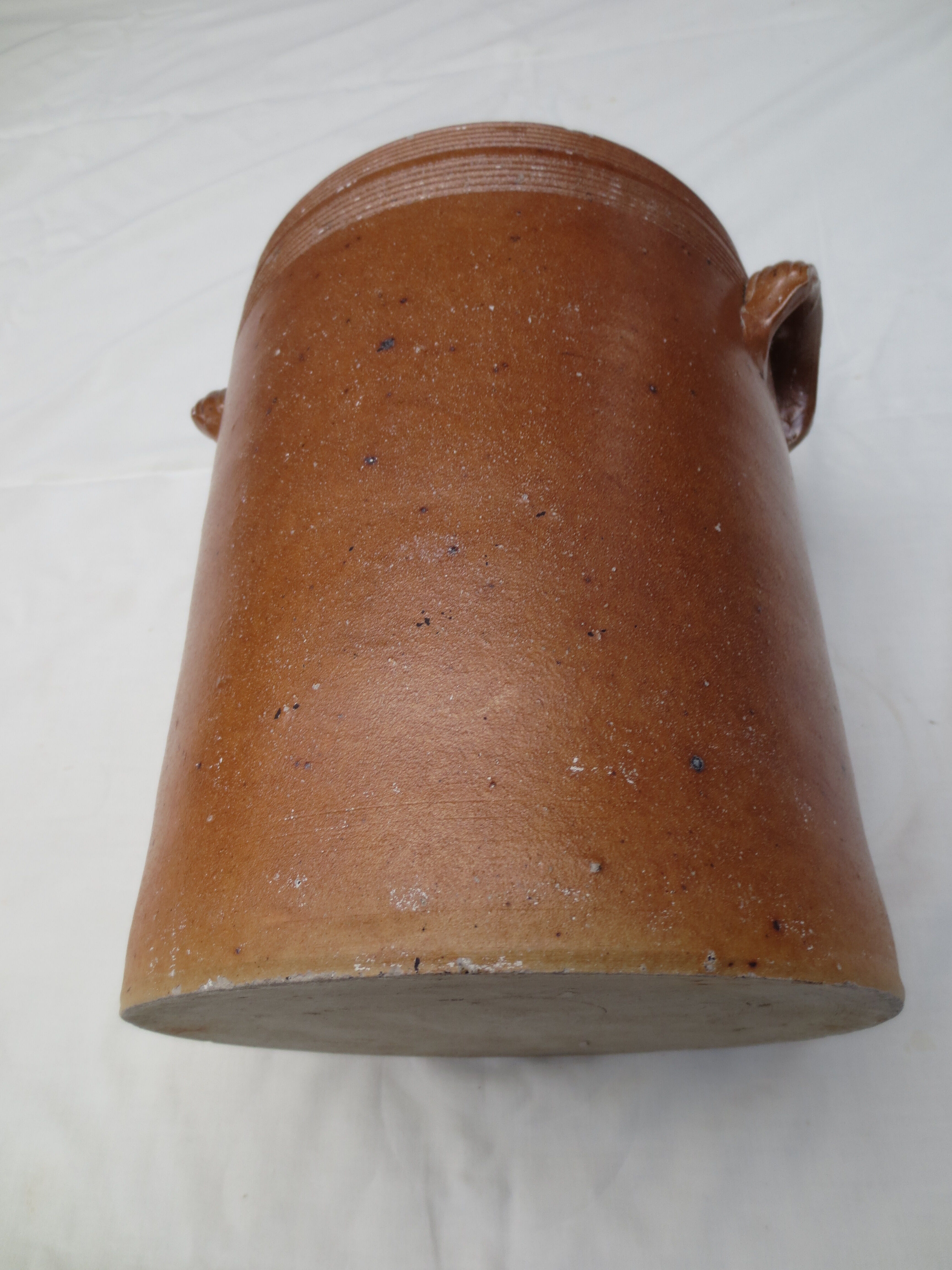 Old butter jug in flaming sandies