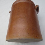 Old butter jug in flaming sandies