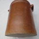 Old butter jug in flaming sandies
