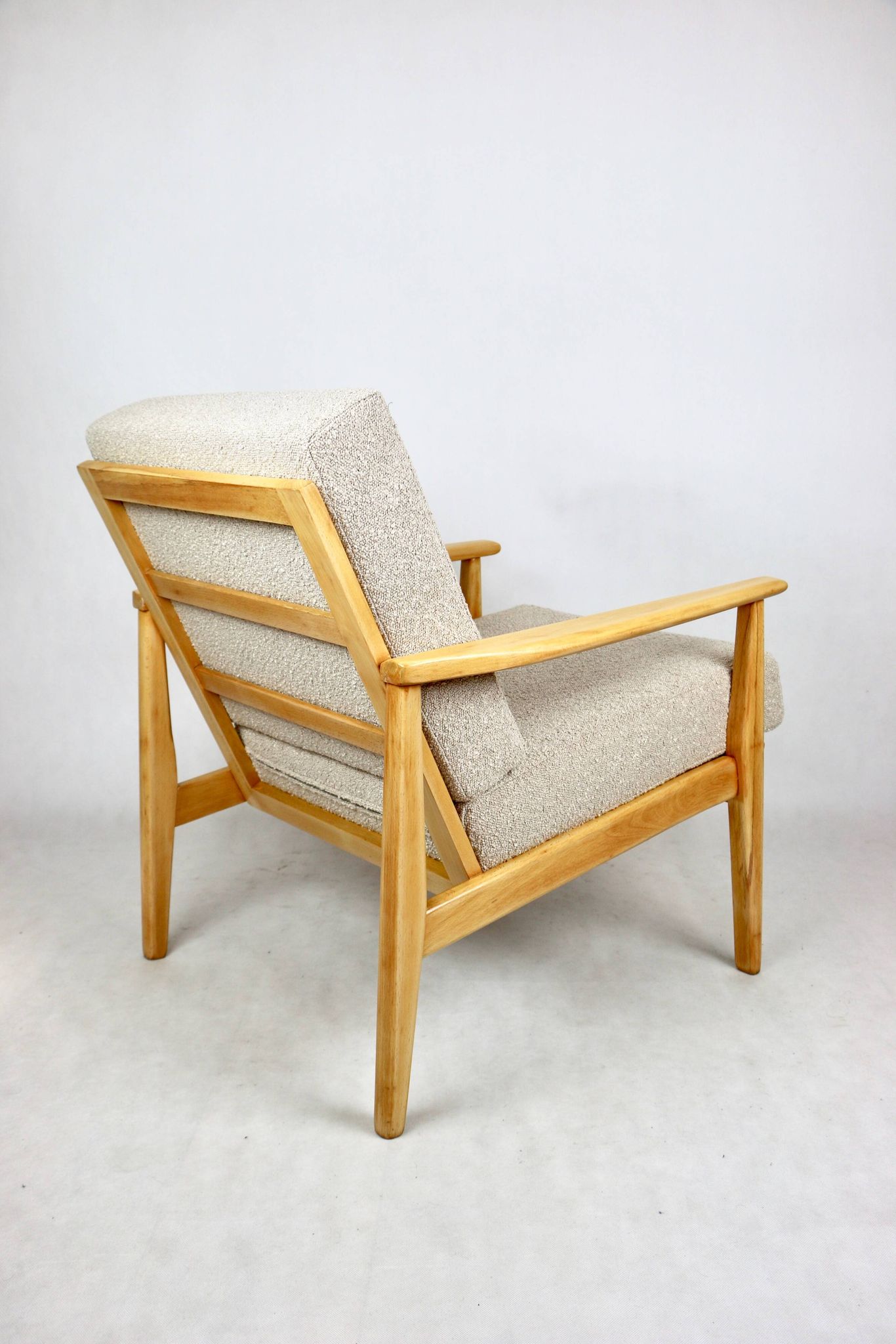 Vintage Danish armchair, 1970s, beige boucle - light wood - 2 pieces available