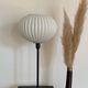 Table lamp with an antique white opaline lampshade and a vintage golden foot