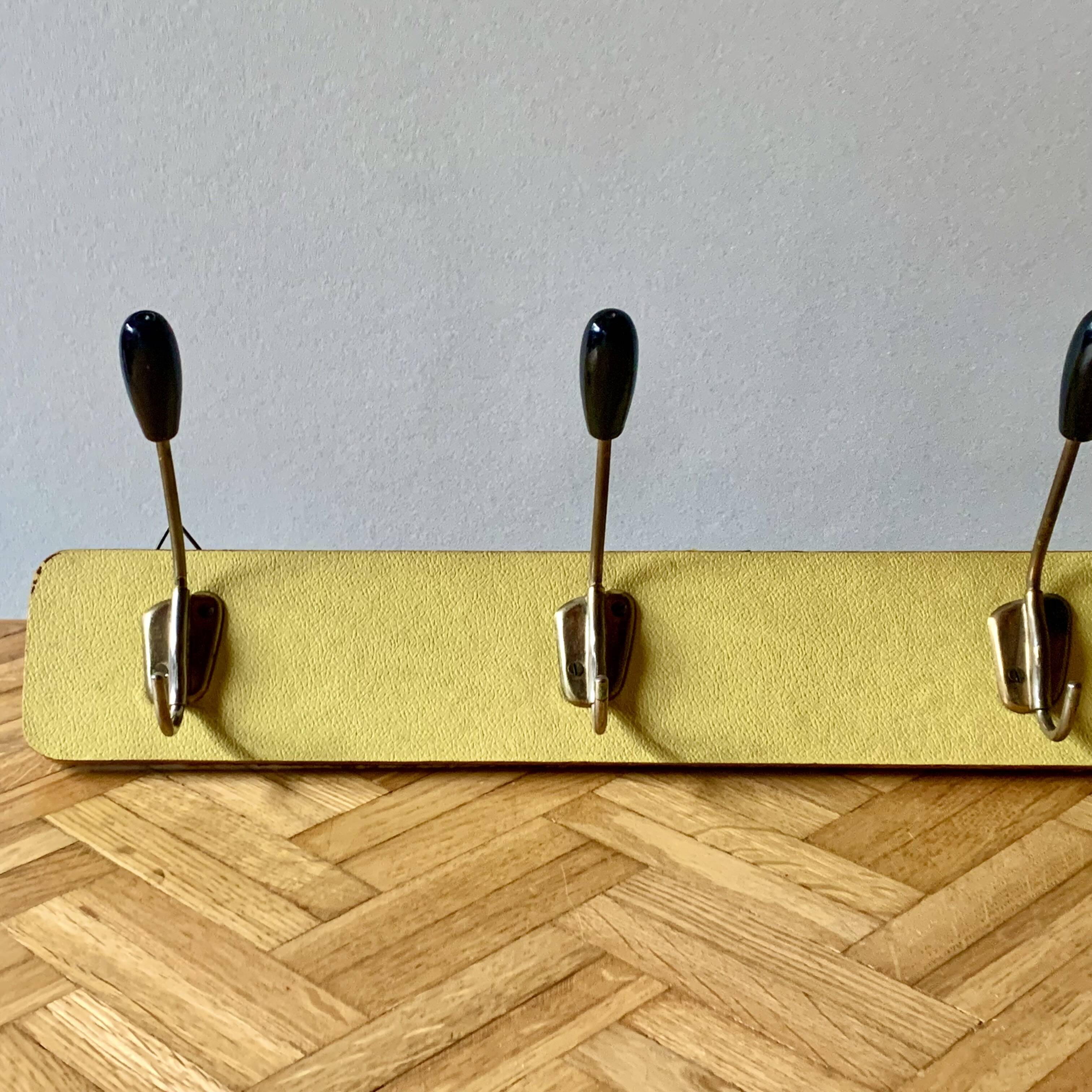 Vintage yellow wall coat rack - four hooks - 1950s