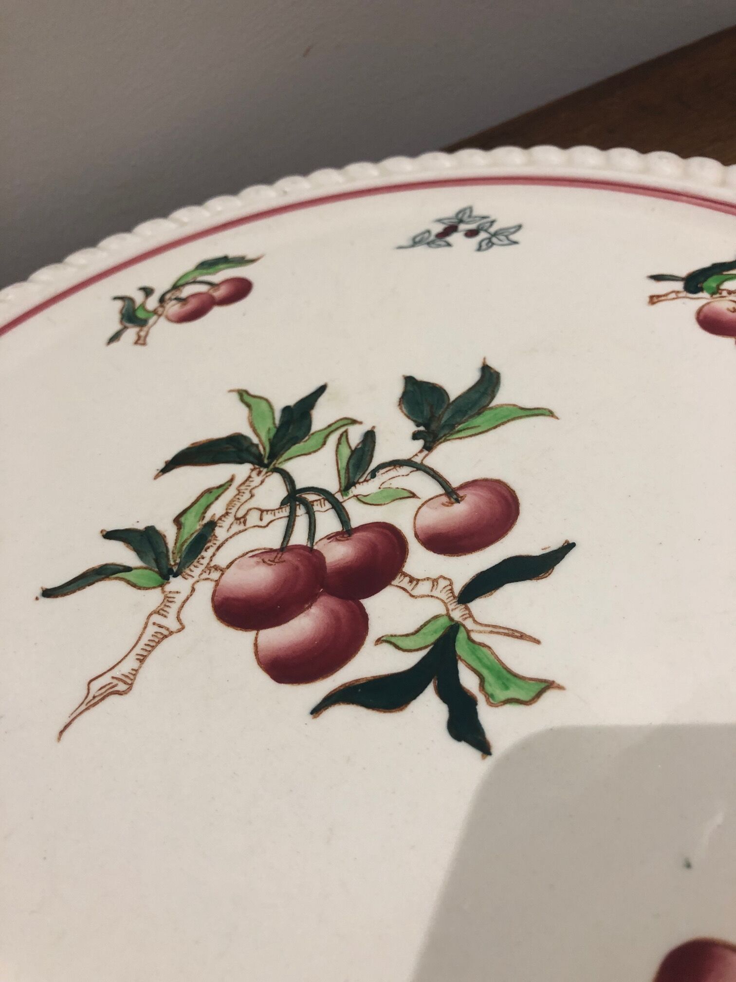 Longwy earthenware dish decorated with cherries