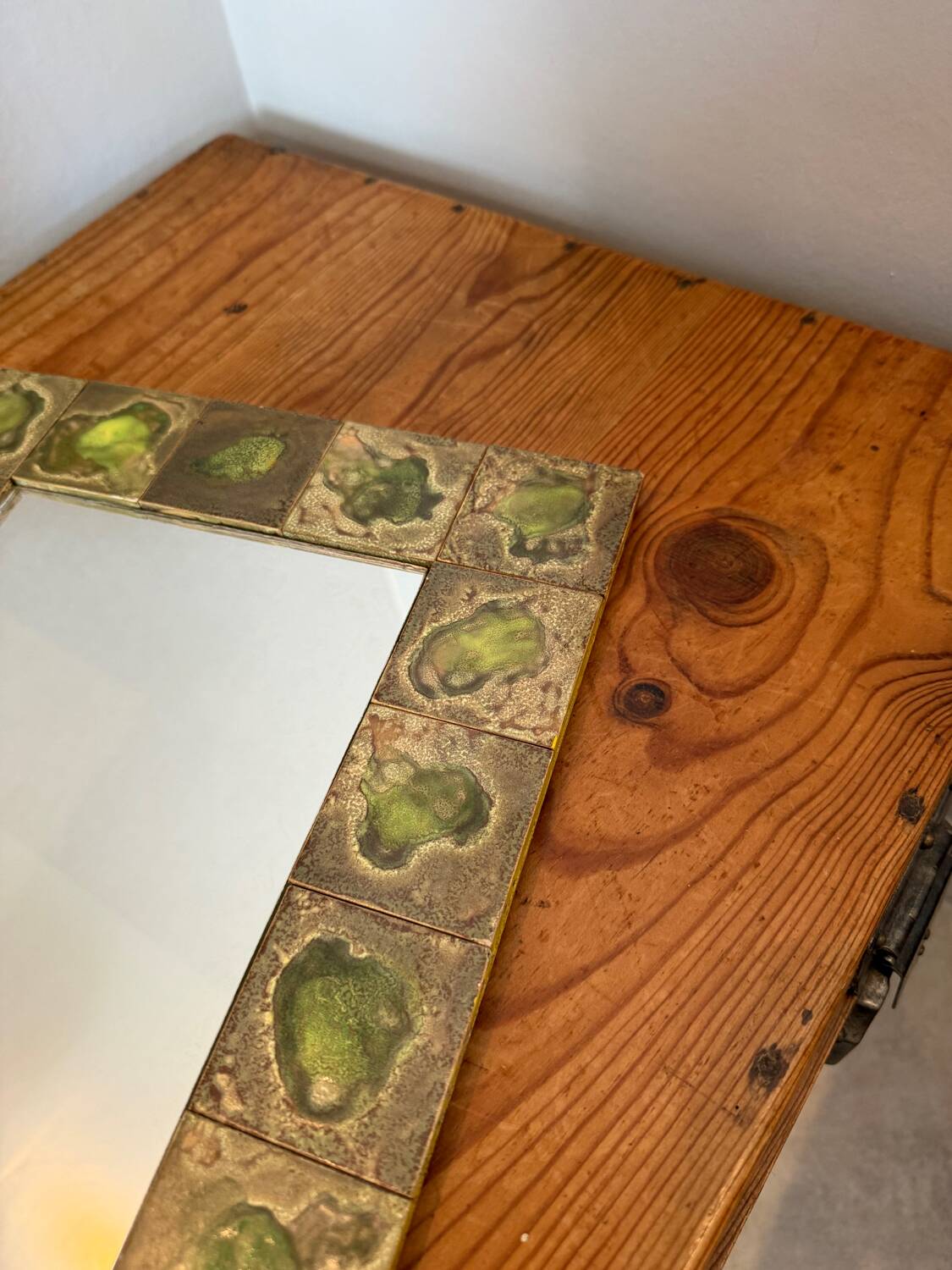 Vintage 1960s green and brown glazed ceramic mirror.
