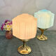 Art Deco lamp from the 1930s with an opaline globe featuring a pink flower.