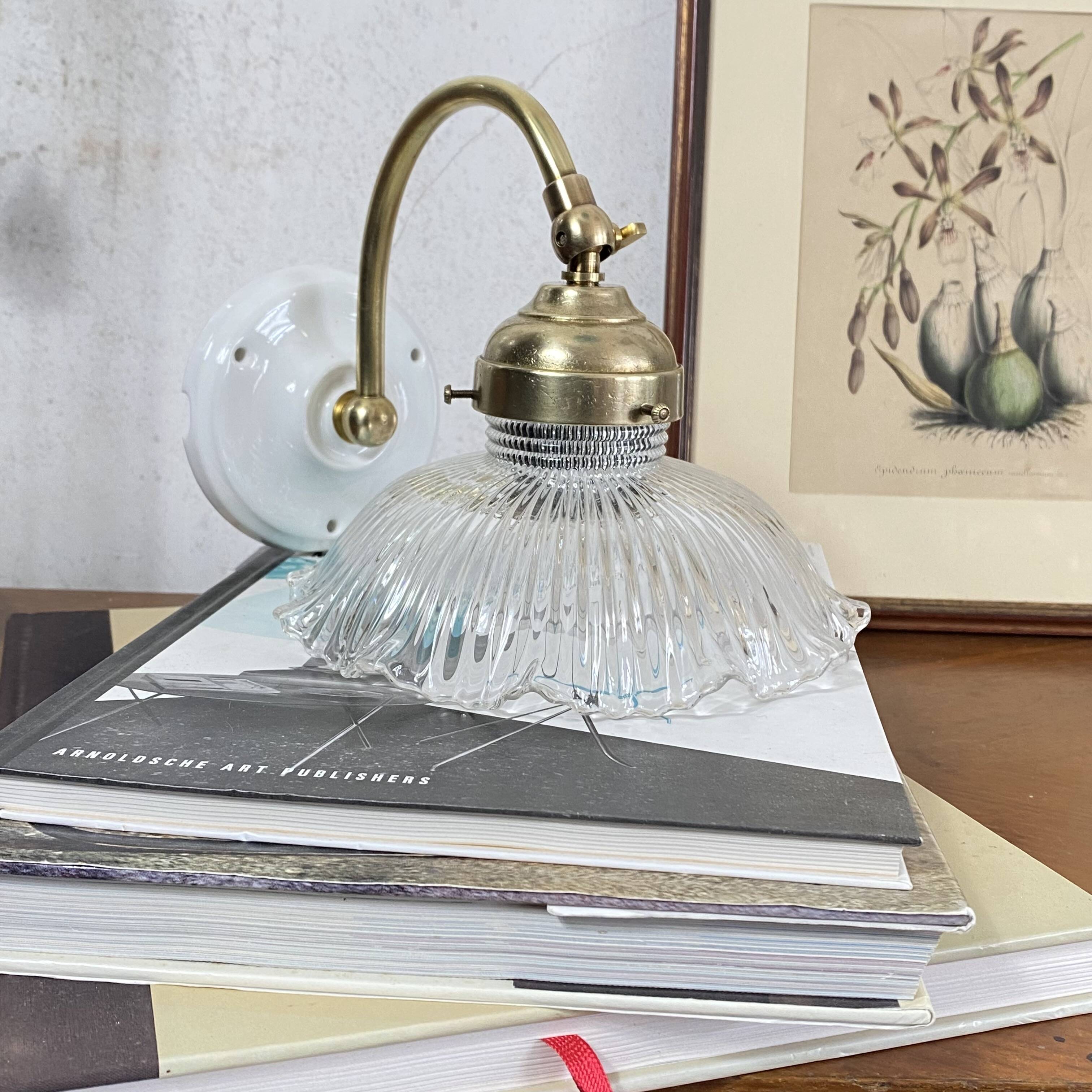 Swan neck wall light in brass with a ribbed glass shade, Holophane type.