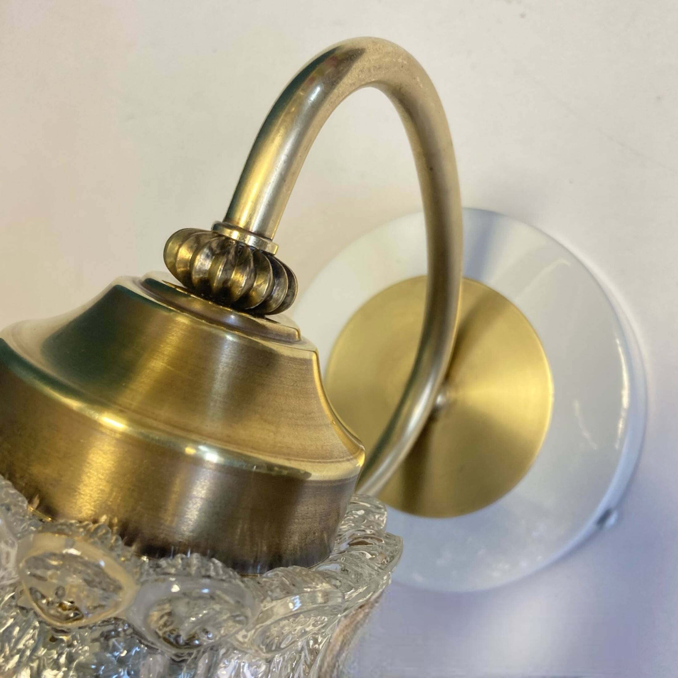 Old brass swan neck wall light and transparent glass tulip vintage decoration