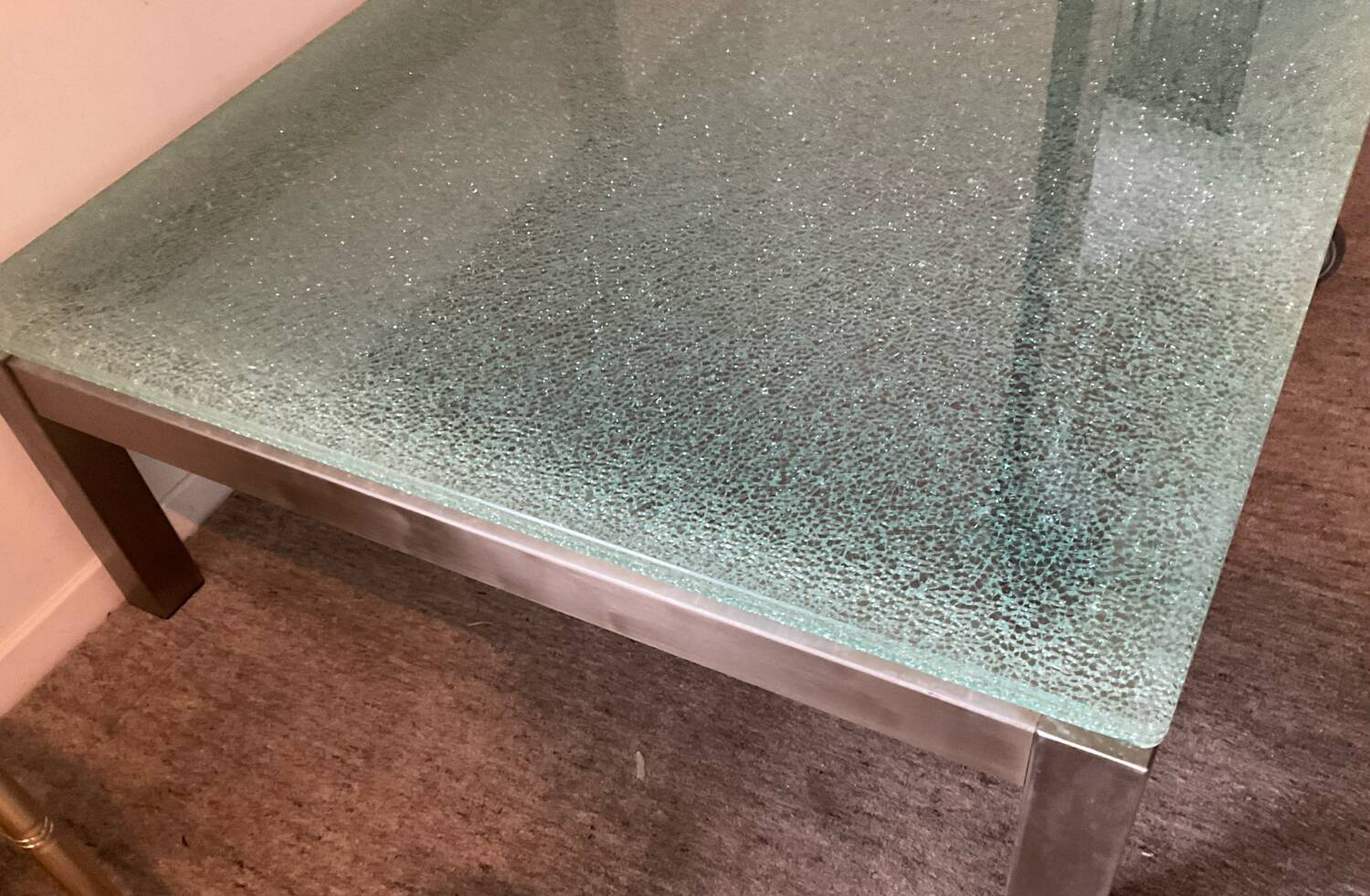 Designer garden coffee table in tempered glass and stainless steel