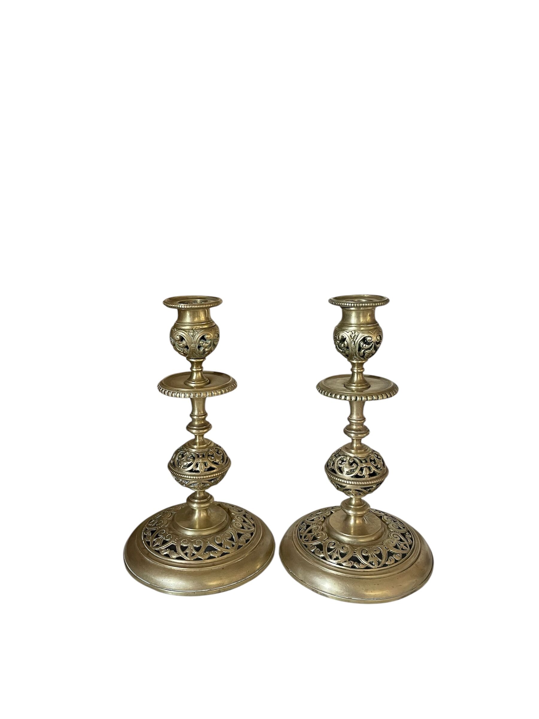pair of openwork gilded brass candlesticks from the 19th century