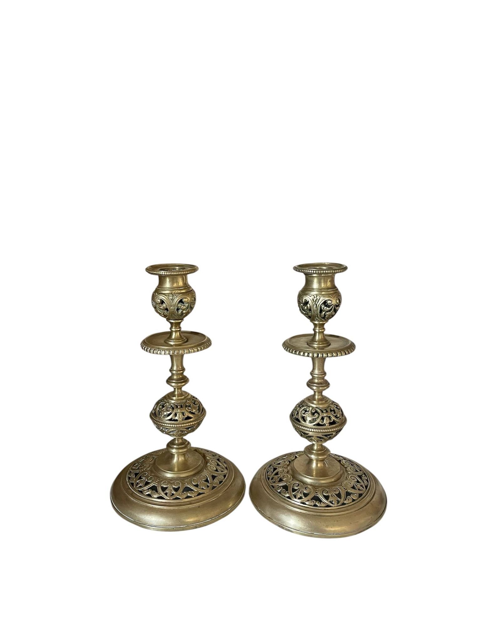 pair of openwork gilded brass candlesticks from the 19th century