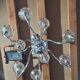 Chandelier from the 1930s to 1950s in chrome metal and thick glass.