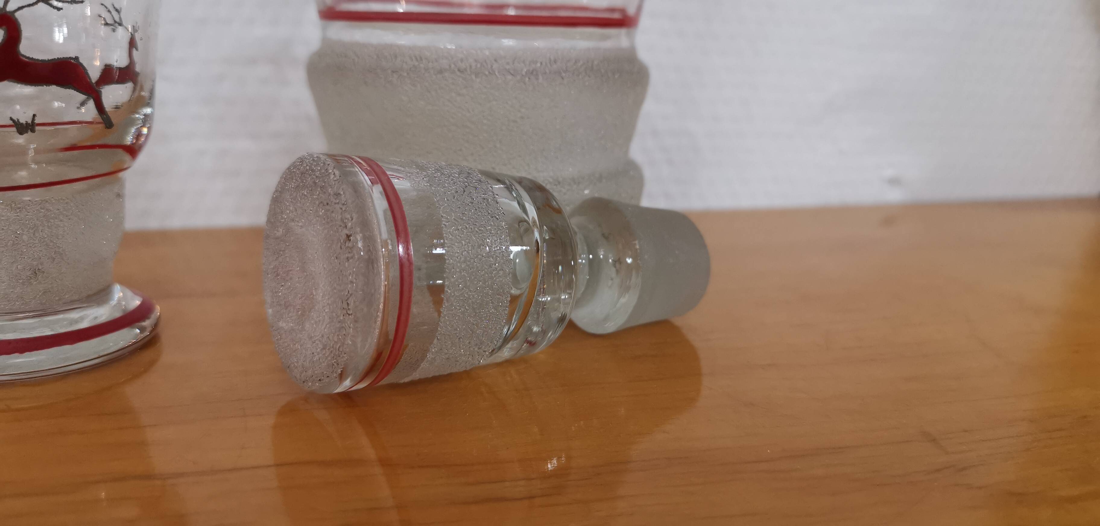 Glasses and carafe decorated with red Christmas reindeer and white granita 60's