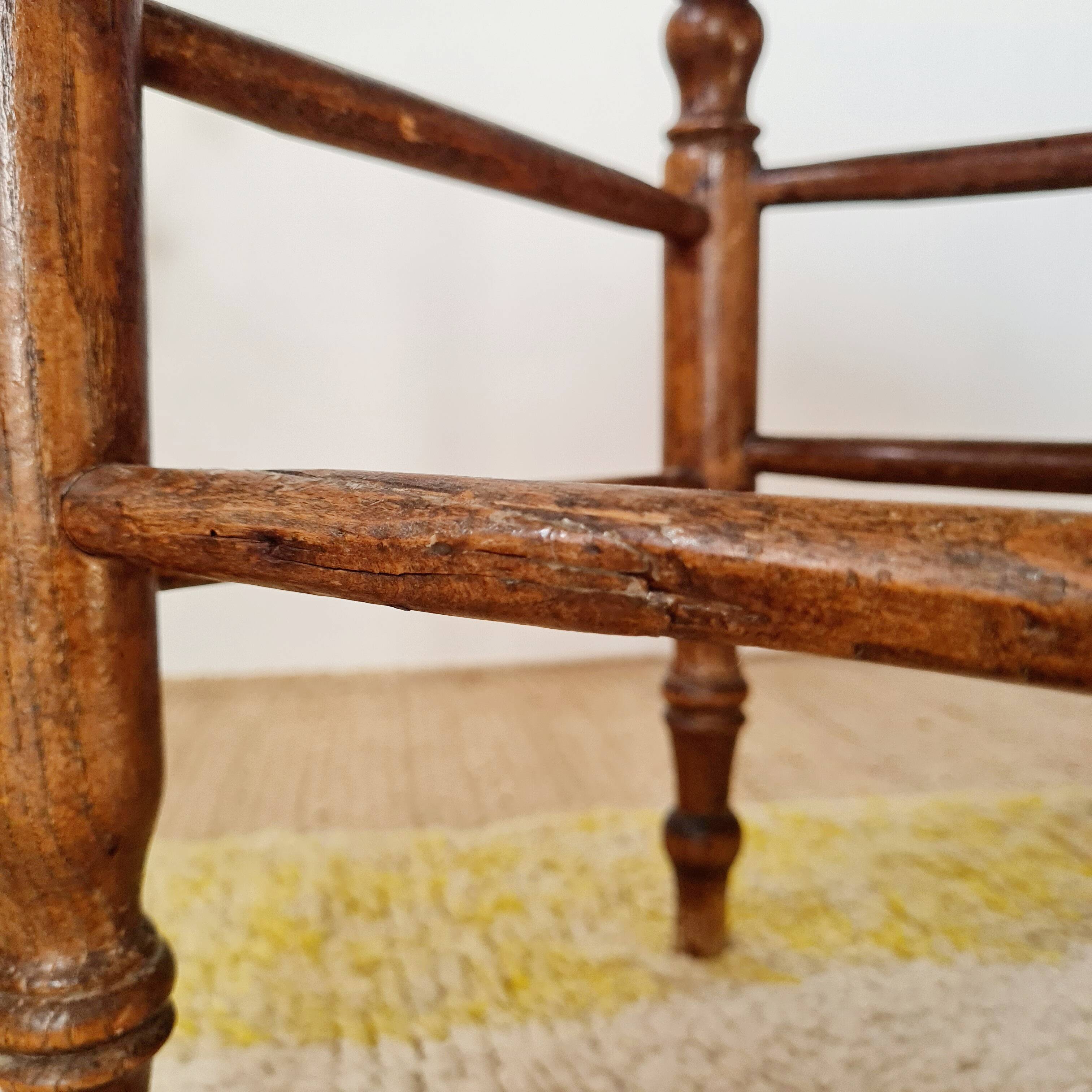 Wooden stool with cane seat