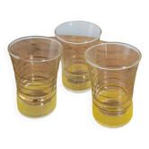 Trio of small yellow granite glasses with gold rims