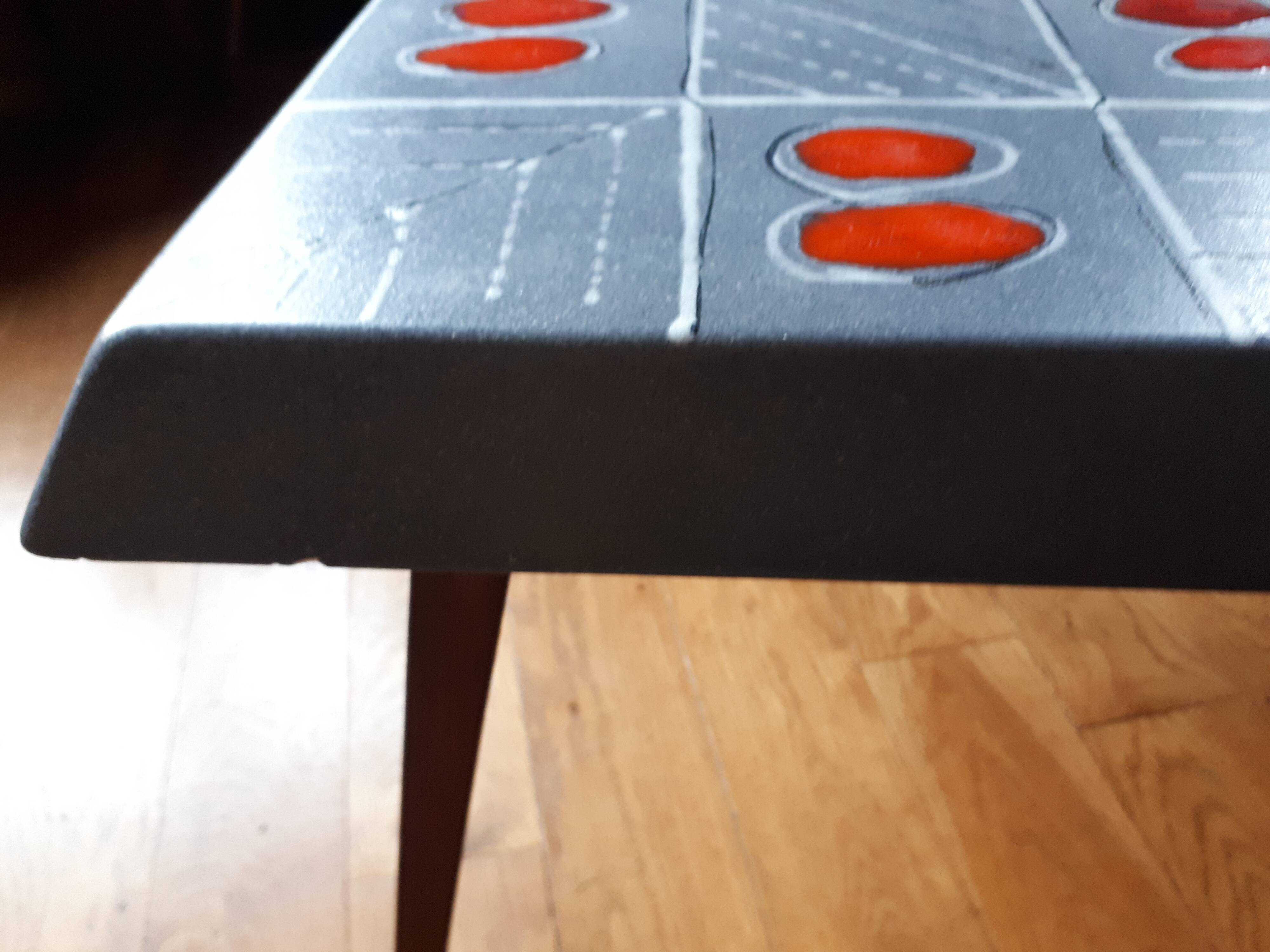 Small 1960s enamelled table, spindle legs, signed jd.